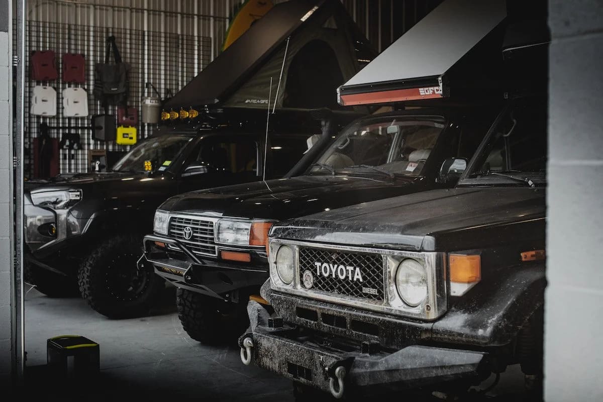 Toyota Land Cruisers parked inside the Spirit of 1876 shop